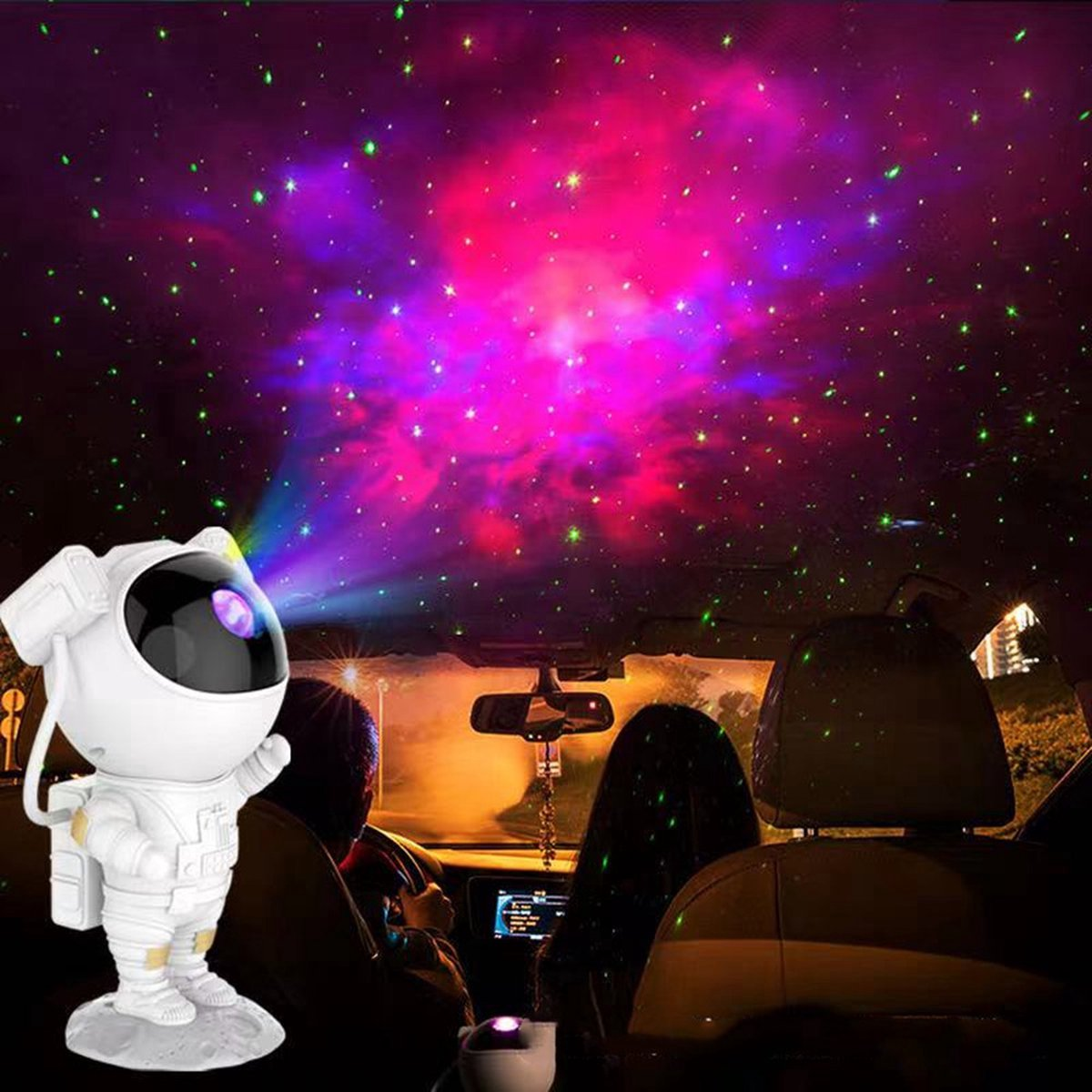 Astronaut projector casts starry sky inside a car with purple and green lights.
