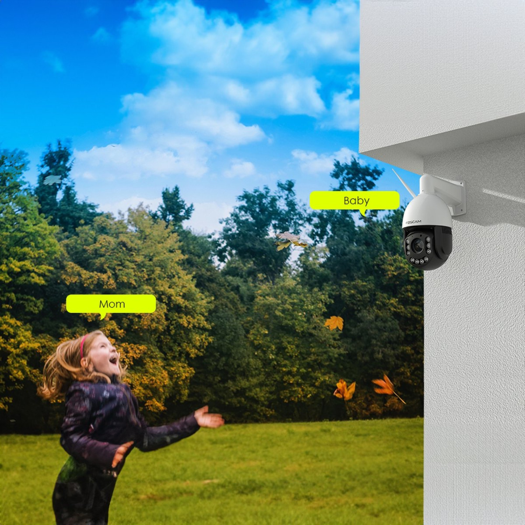 A girl throws leaves in the air, a camera is mounted on the wall.