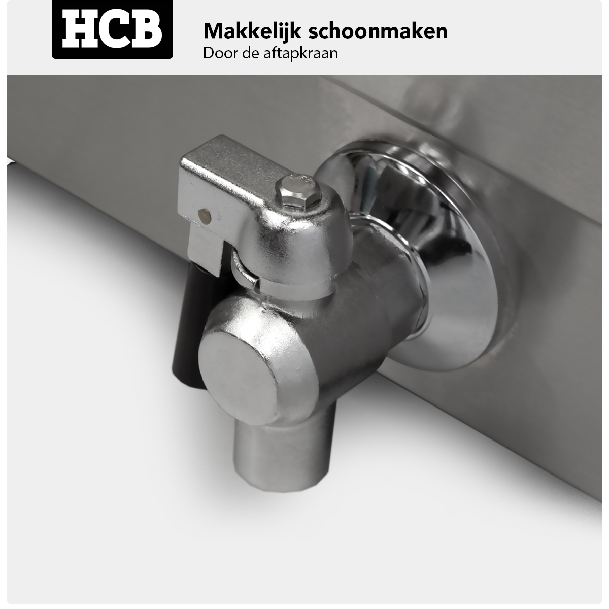 Close-up of a silver tap on a metal device with HCB logo.