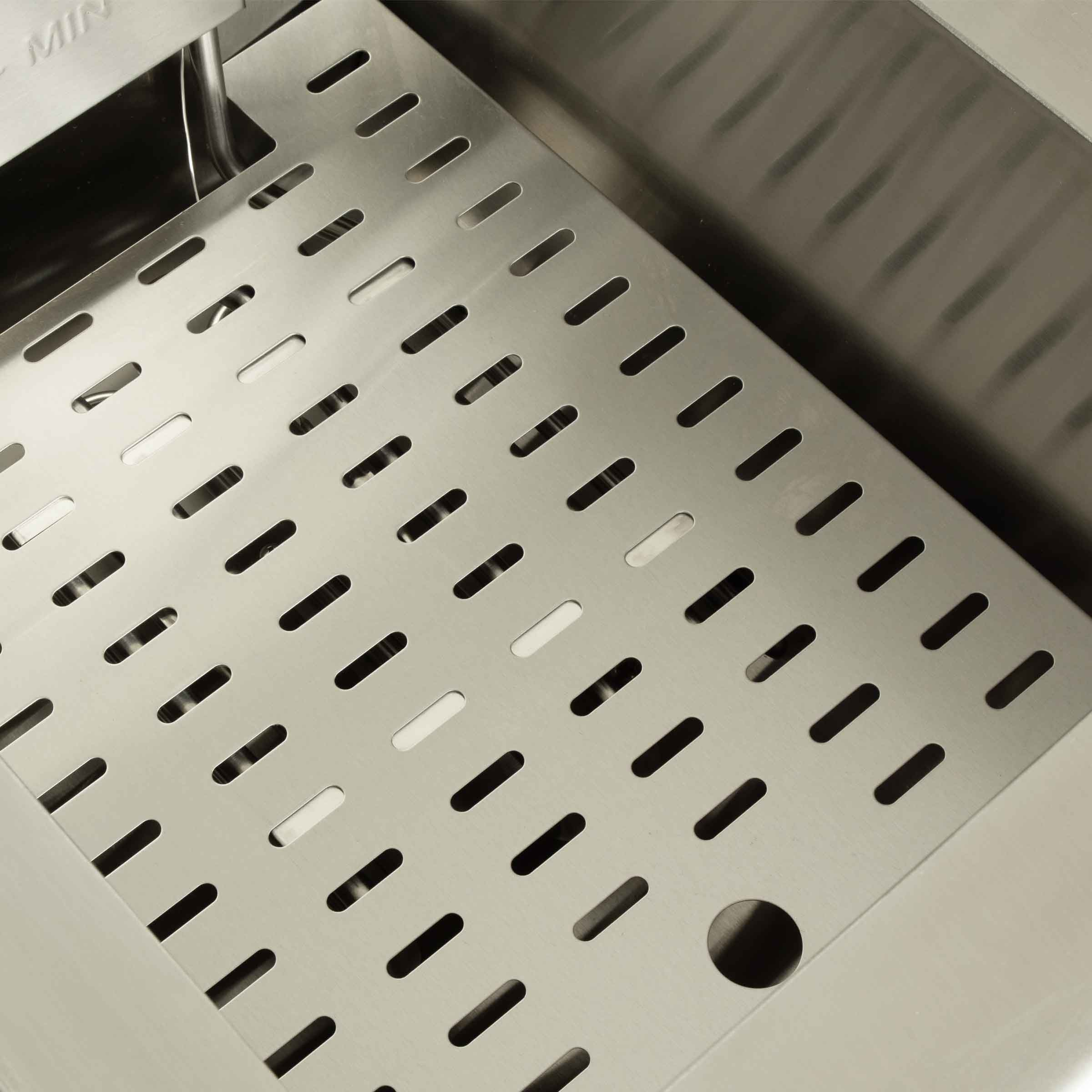 Stainless steel basin with perforated insert and handle.
