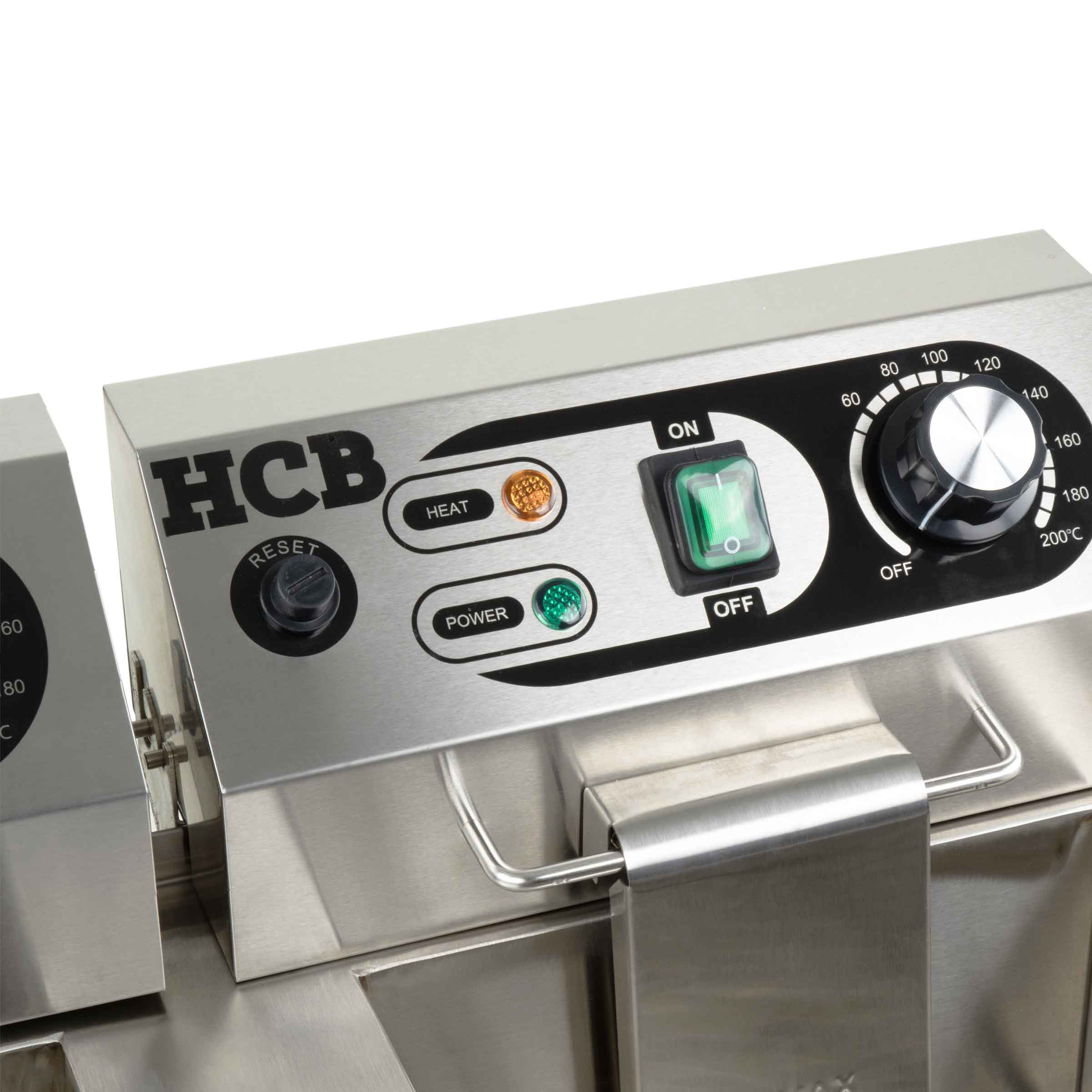 Stainless steel control panel with dial, switch, and indicators.