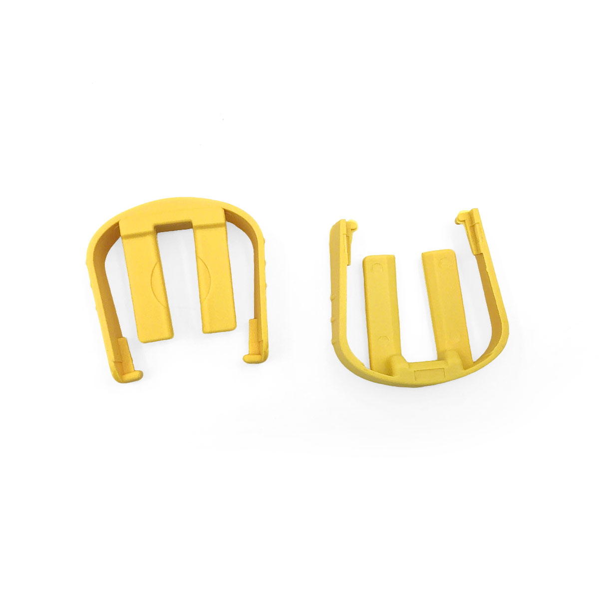 Dwa żółte plastikowe części z nacięciami na białym tle.