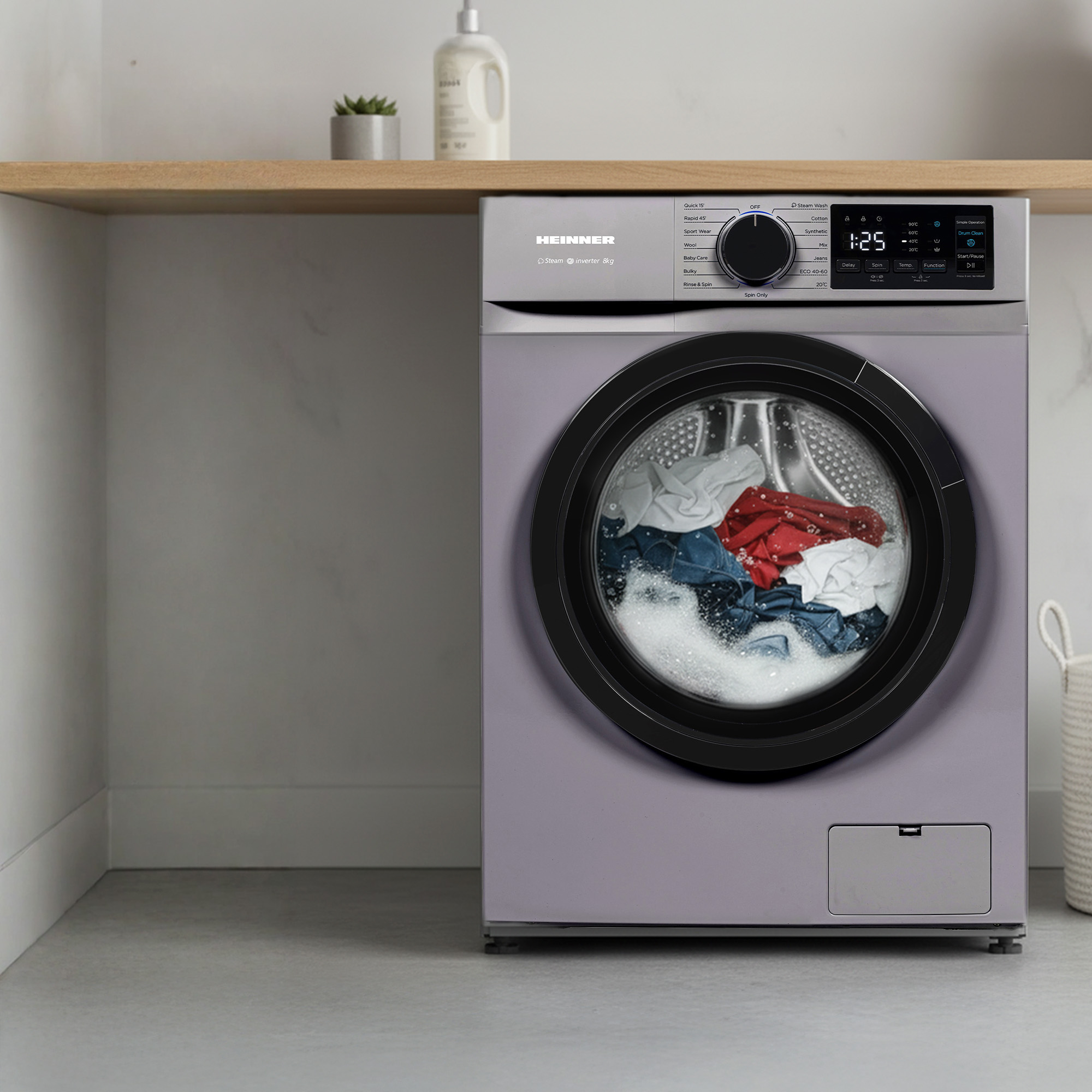 A washing machine with a full drum of colorful clothes and foam.
