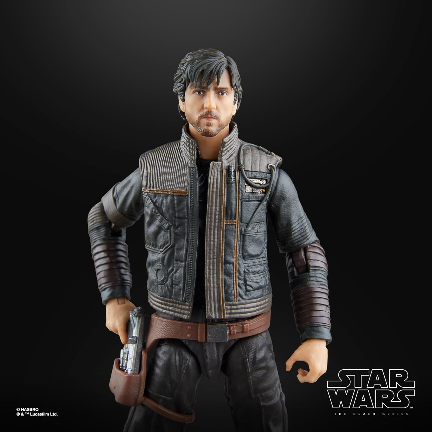 Ein Star Wars Actionfigur eines Mannes mit braunem Haar, der eine Jacke und eine Pistole trägt.
