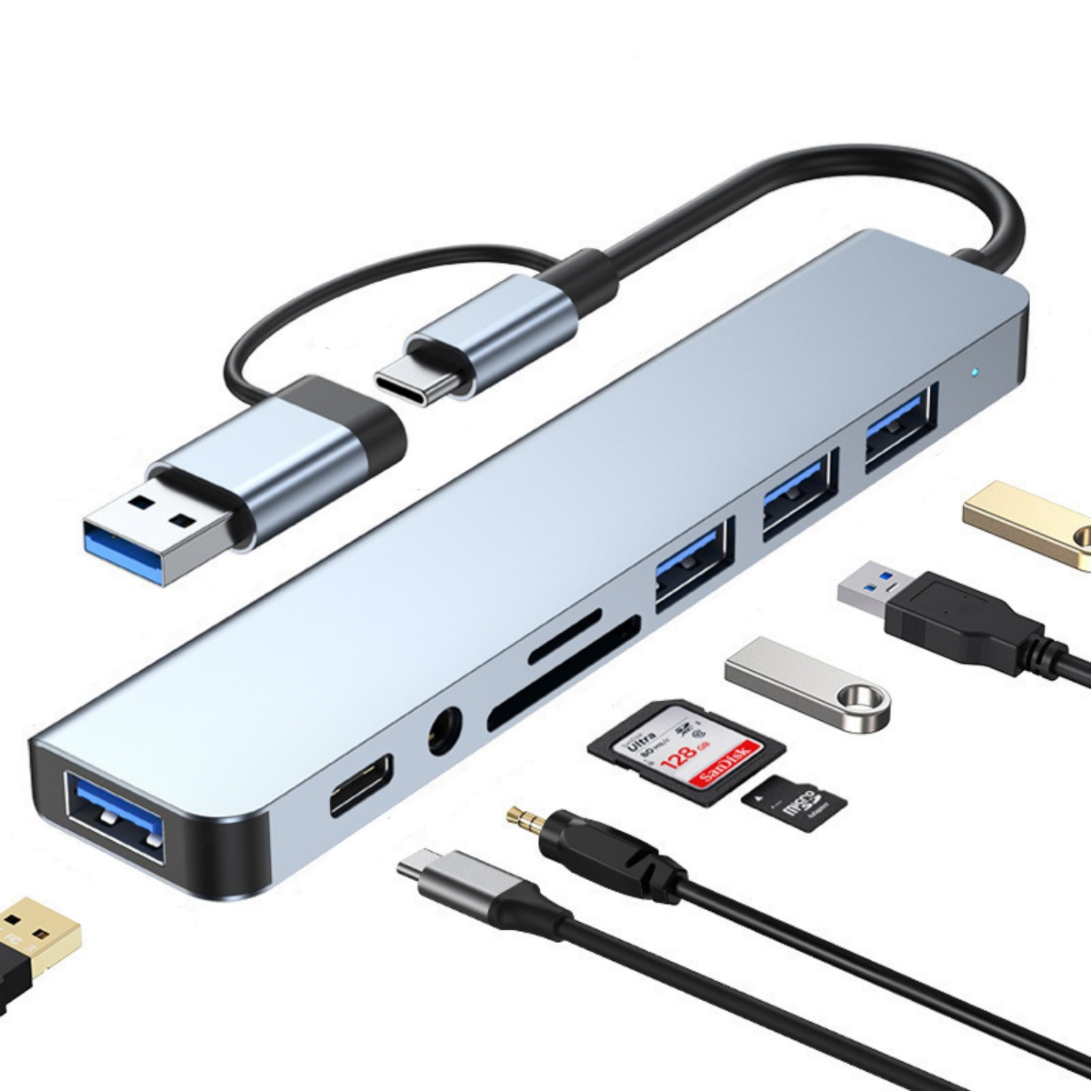 Ein silberner USB-C-Hub mit mehreren Anschlüssen und Zubehörteilen.