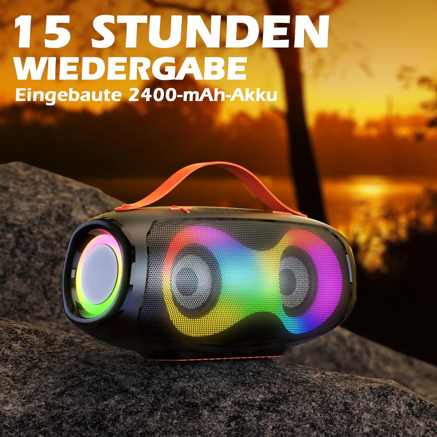Przenośny głośnik z kolorowymi światłami, na skałach o zachodzie słońca.