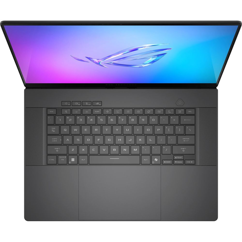 Laptop grigio scuro aperto mostra tastiera, touchpad e schermo illuminato con design astratto.