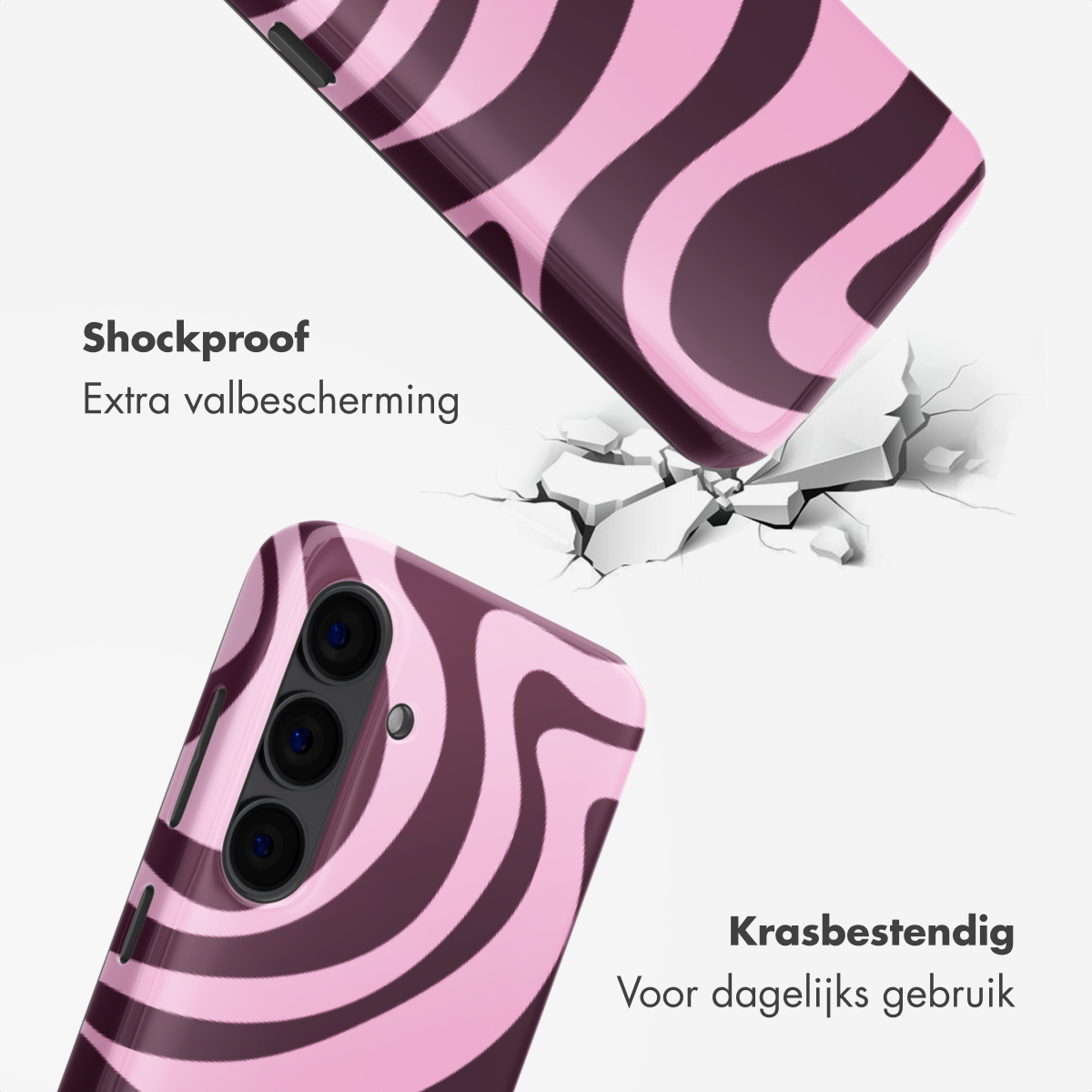 Coque de téléphone rose à rayures marron tombant sur un sol craquelé.