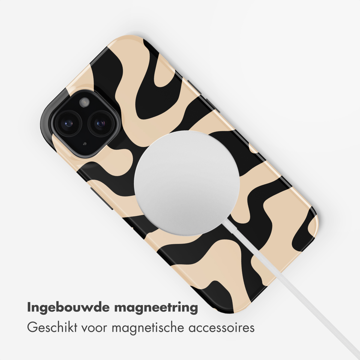 A phone with a black and beige pattern and a MagSafe charger.