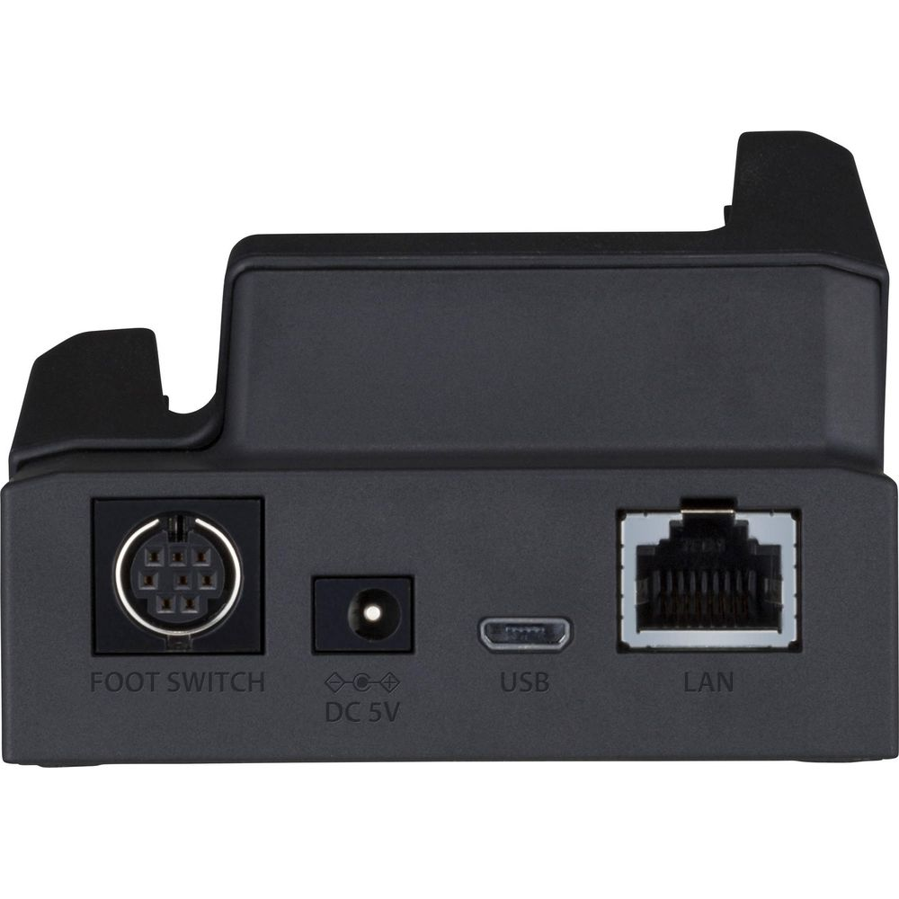 Rückseite eines schwarzen Geräts mit Anschlüssen: Fußschalter, DC 5V, USB und LAN.