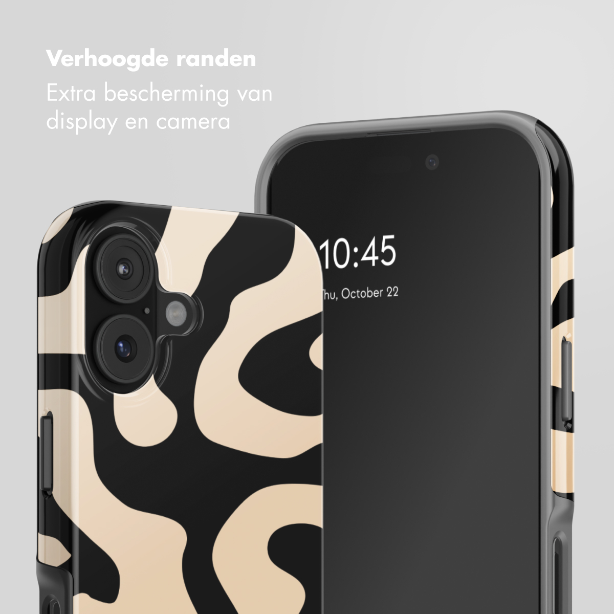 Custodia per telefono nera e beige con motivo astratto, accanto a un telefono.