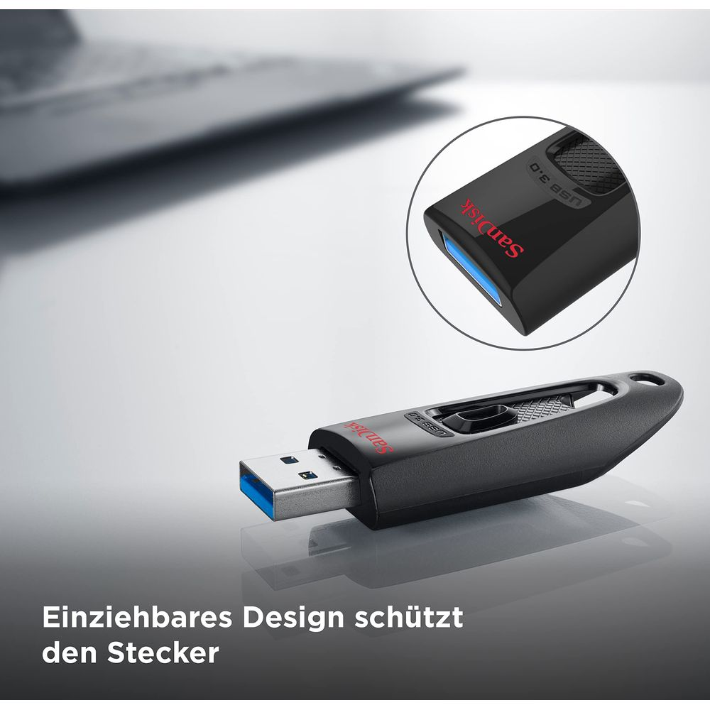 Chiavetta USB nera con connettore blu, vicino a un laptop. Retrattile.