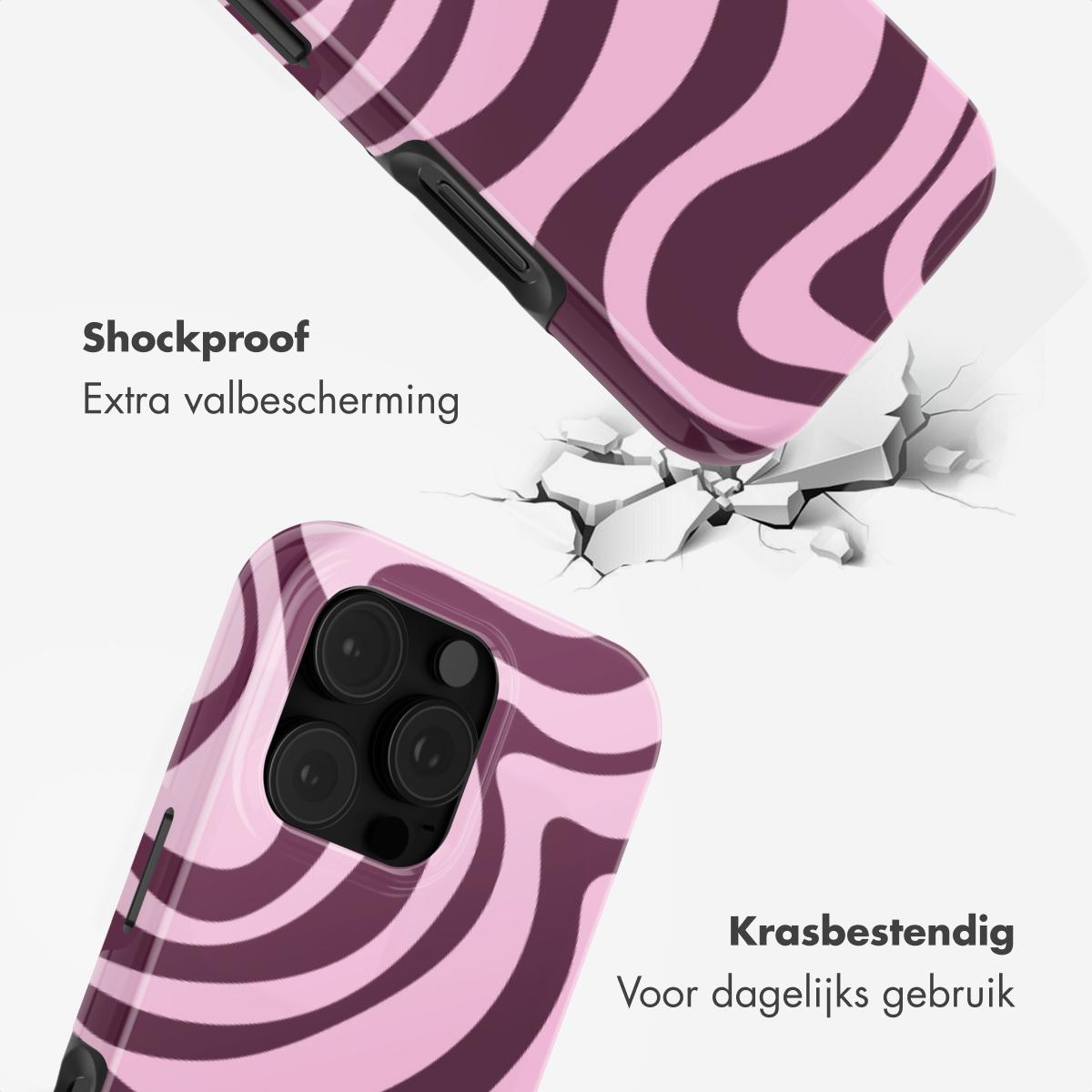Roze en bordeauxrode telefoonhoes met golvend patroon valt op gebarsten oppervlak.