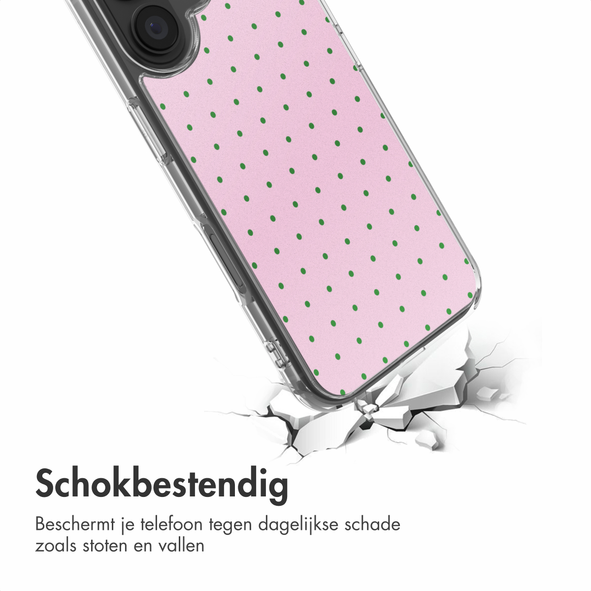 Roze telefoonhoes met groene stippen die op een gebarsten ondergrond valt.