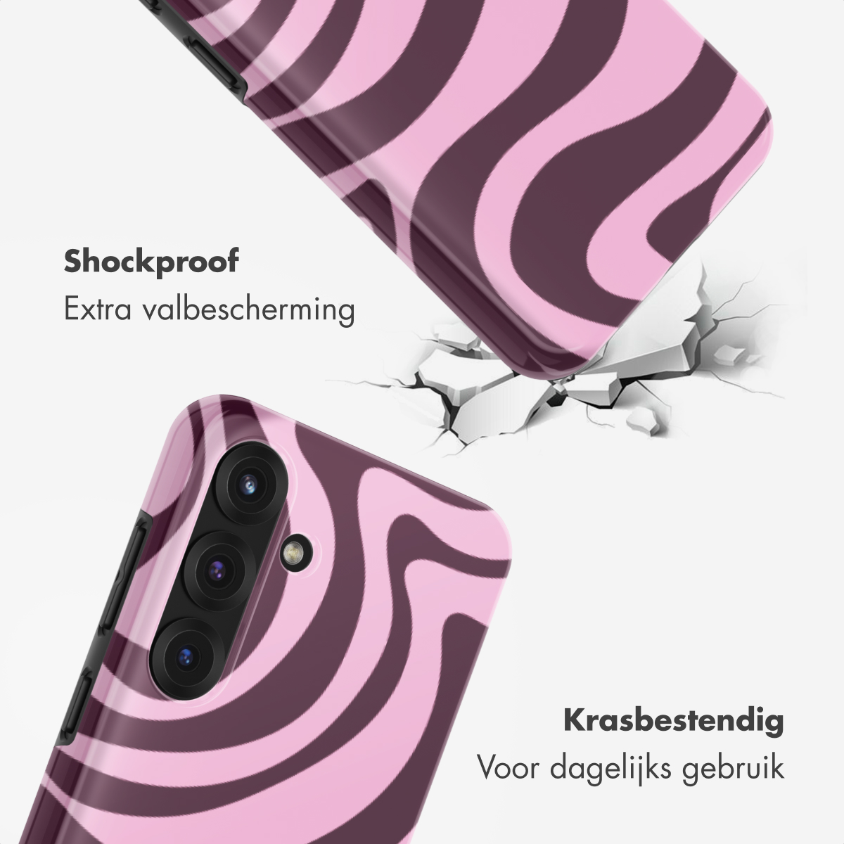 Roze en bruine telefoonhoes met zebraprint valt op gebarsten grond.
