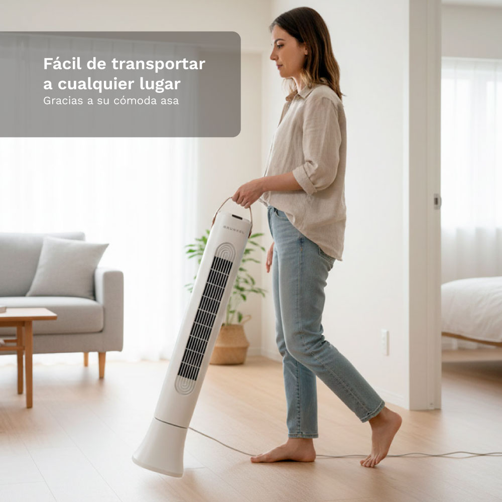 Kobieta przenosi biały wentylator wieżowy przez salon.