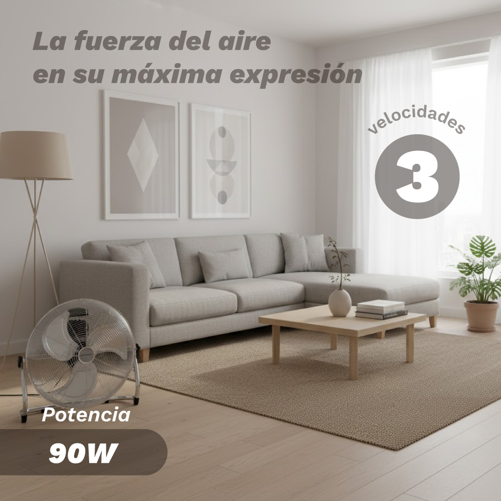 Un ventilatore argento accanto a un divano in un soggiorno moderno.