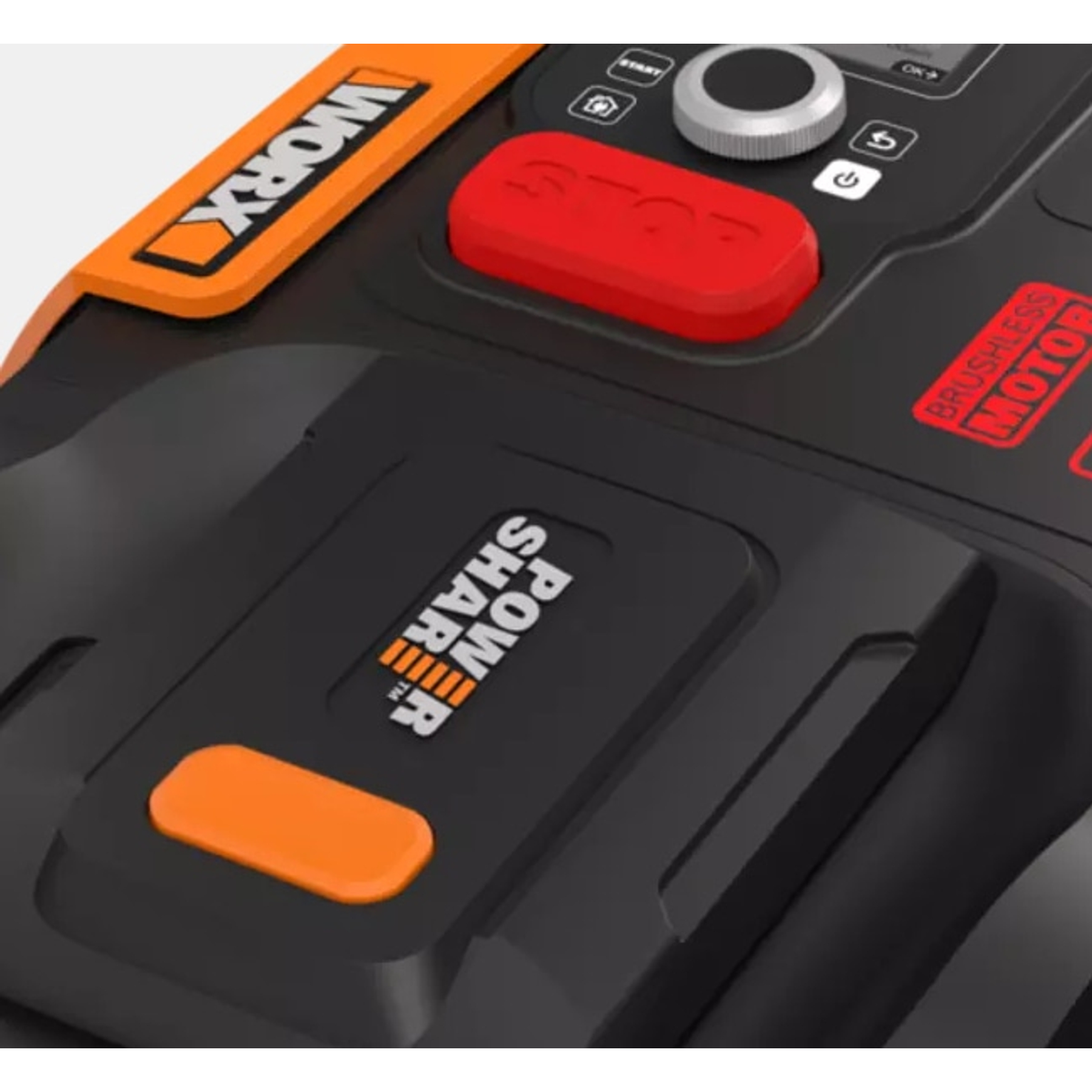 Close-up of a black lawn mower with orange and red accents.