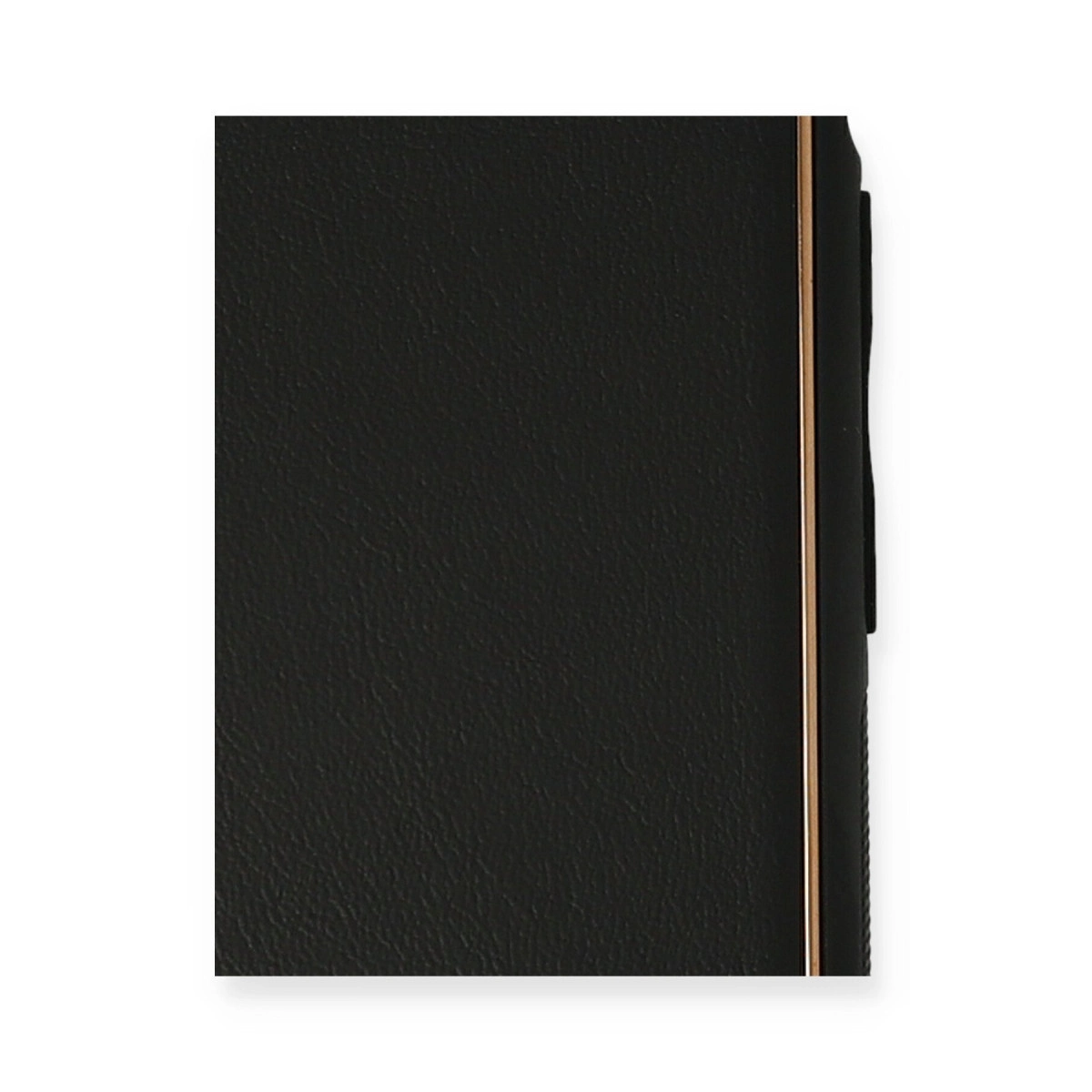 Altın kenarlı siyah defter, yakın çekim.