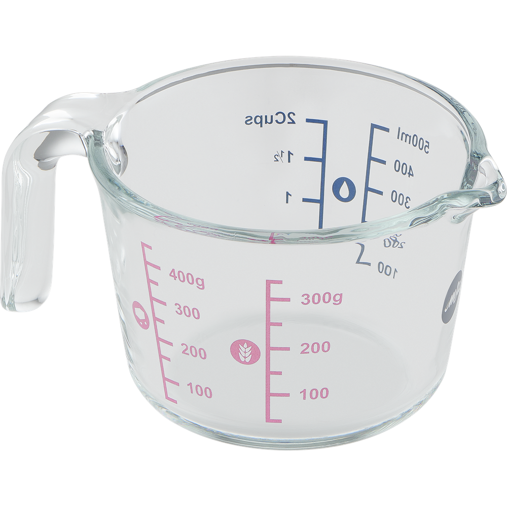 Eine durchsichtige Glas-Messbecher mit ml- und Gramm-Markierungen.