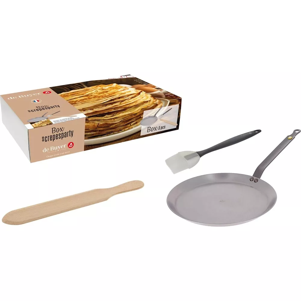 Crêpe-Party-Box mit einer Bratpfanne, einem Spatel und einem Holzstreuer.