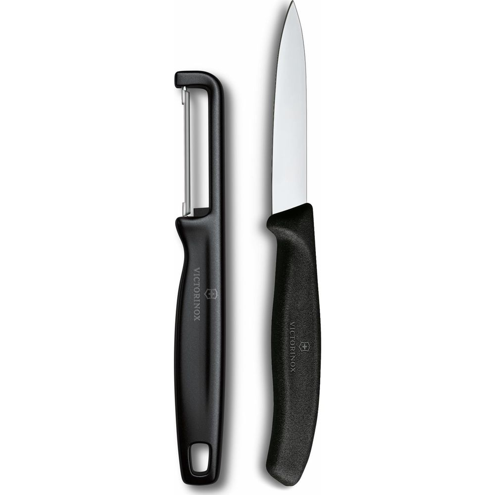 Ein schwarzer Sparschäler und ein schwarzes Messer mit weißem Griff liegen nebeneinander.