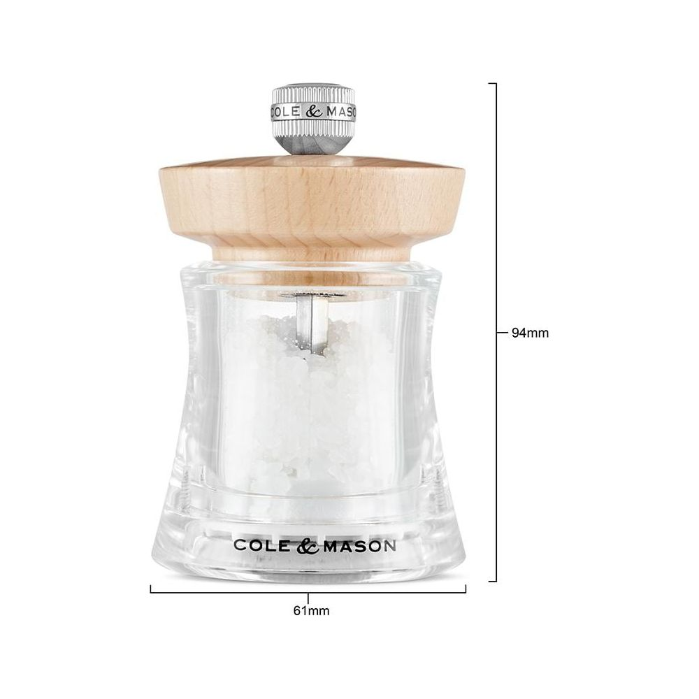 Eine klare Glas-Salzmühle mit Holzoberteil und Metall-Mahlwerk.