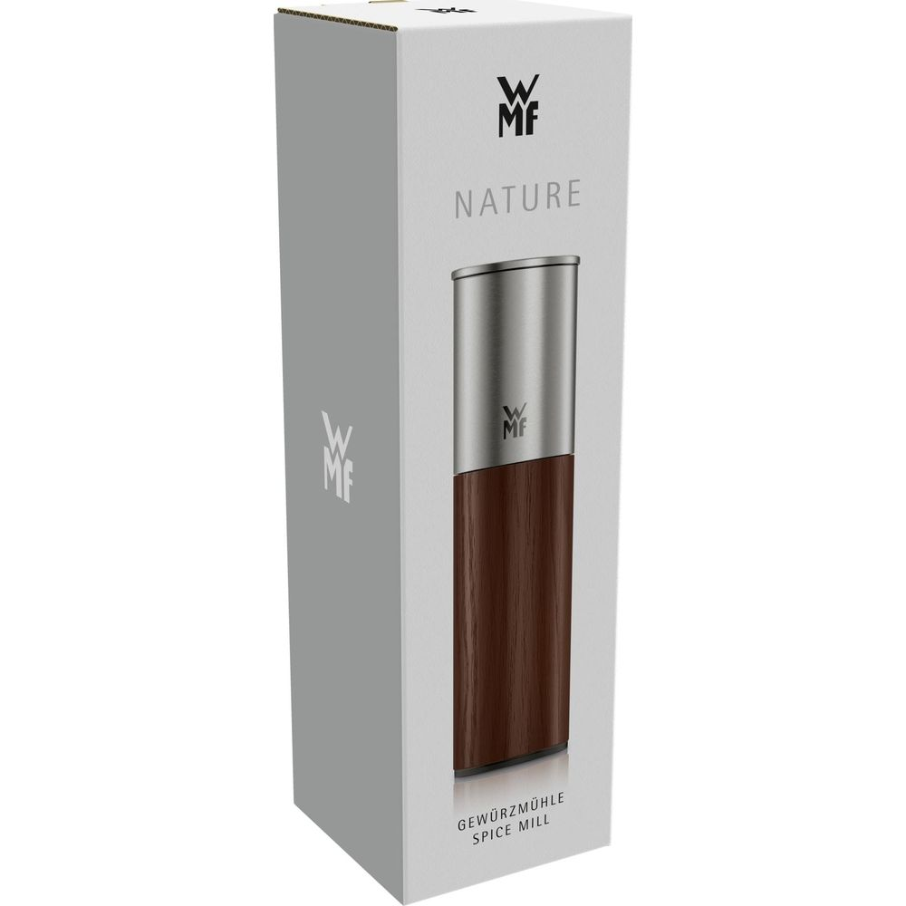 Eine Gewürzmühle mit Holzgehäuse und Edelstahlaufsatz auf Verpackung.