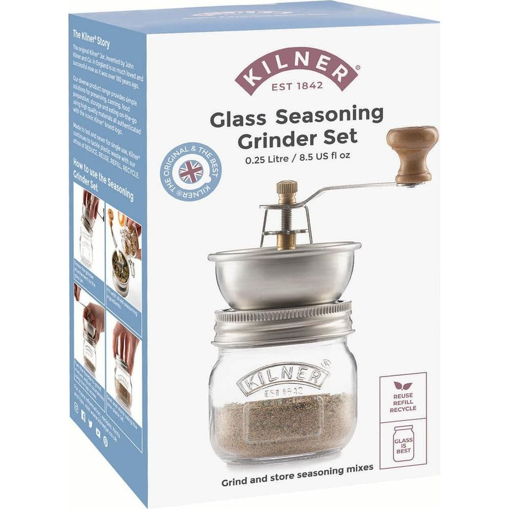 Ein Kilner Glas-Gewürzmühlen-Set mit Holzgriff und Metallmahlwerk auf einem Glasbehälter.