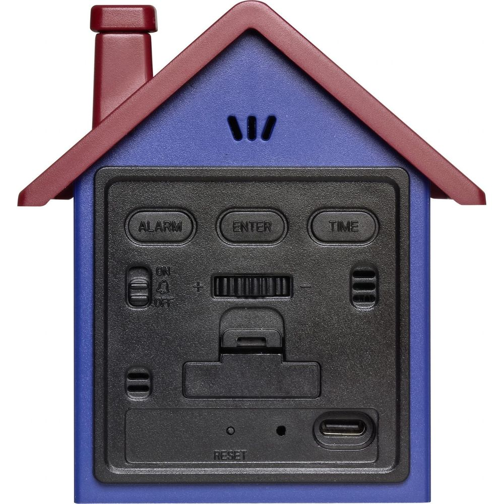 Réveil bleu en forme de maison avec toit rouge. Panneau de contrôle noir avec boutons.