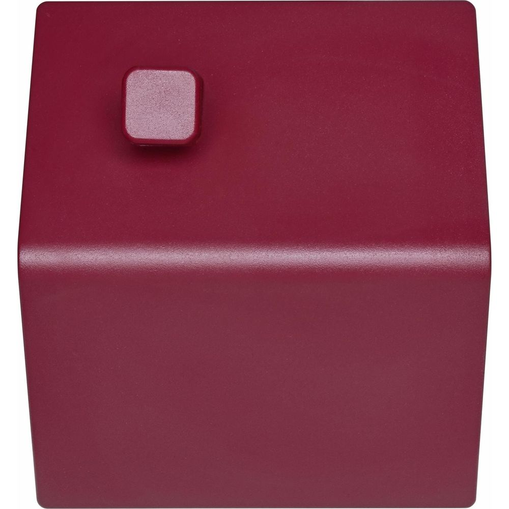 Un objet rectangulaire, bordeaux, avec un petit bouton carré en haut à gauche.