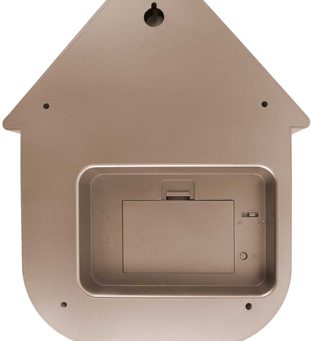 Dos d'un appareil en forme de maison, compartiment pile et boutons de réglage.