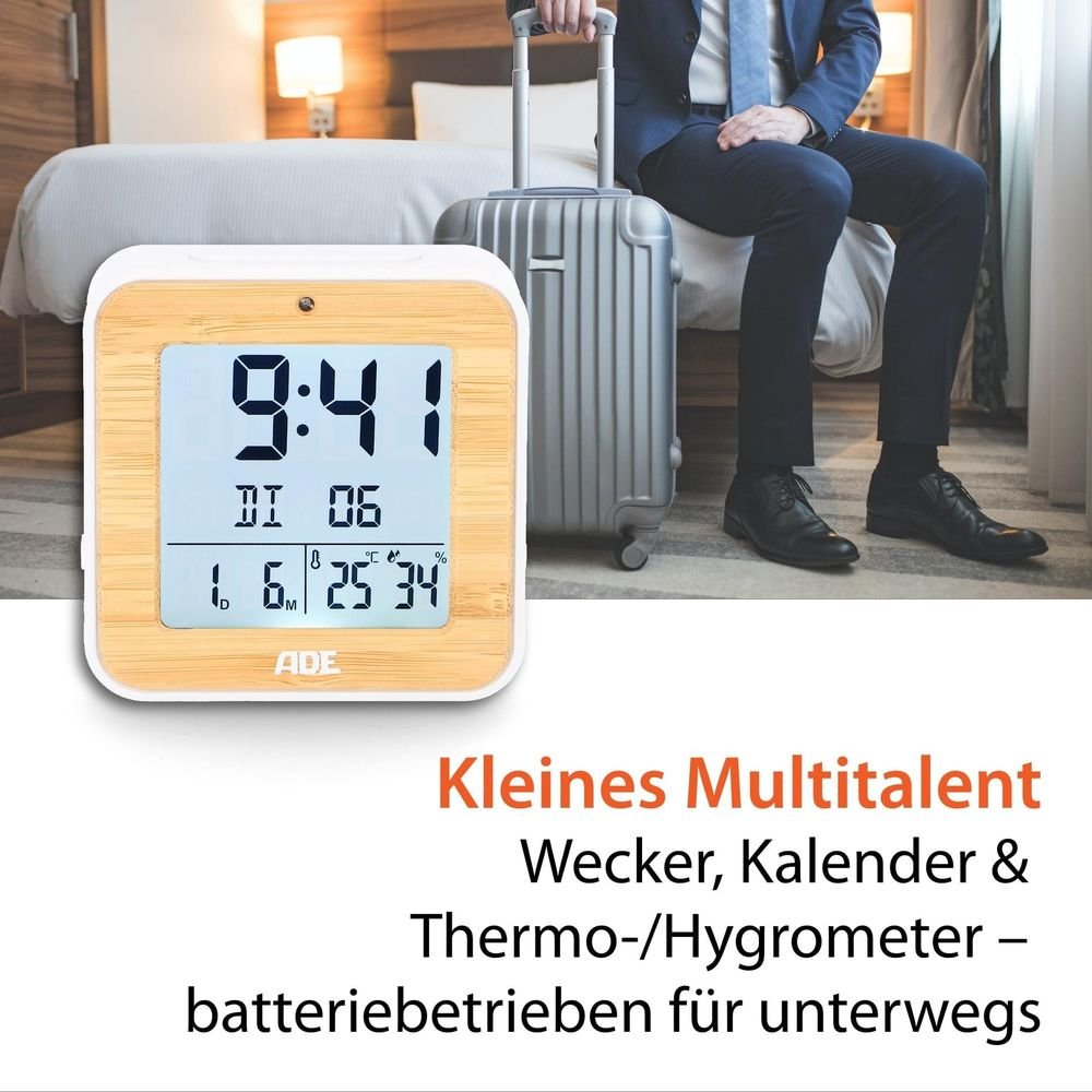 Digitaluhr mit Holzrahmen zeigt 9:41, Datum, Temperatur und Luftfeuchtigkeit.