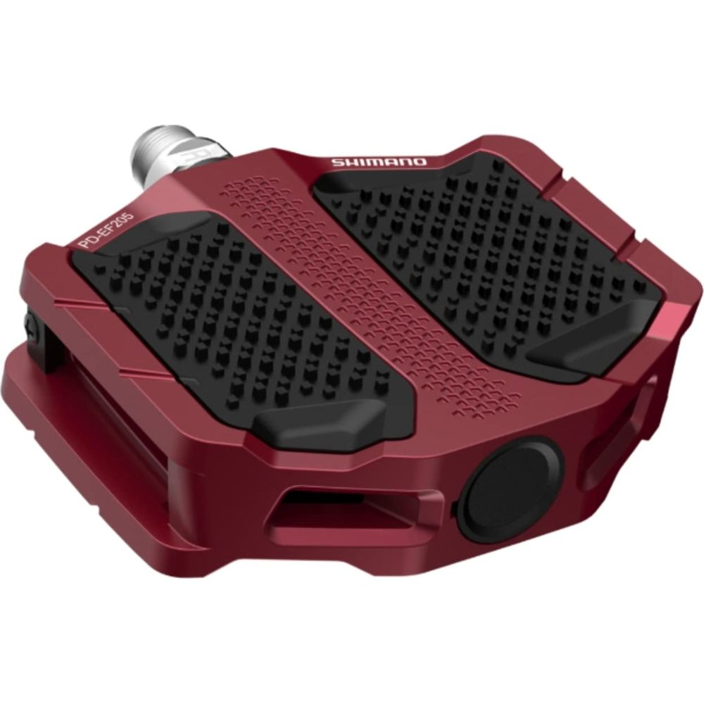 Roter Fahrradpedal mit schwarzer, griffiger Lauffläche und SHIMANO-Schriftzug.