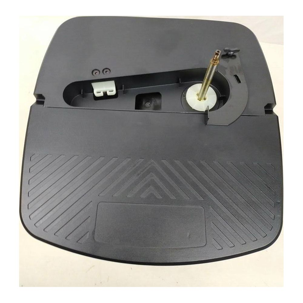 Schwarzes Plastikteil mit Rillenmuster und einem Metallstift mit weißem Rad.