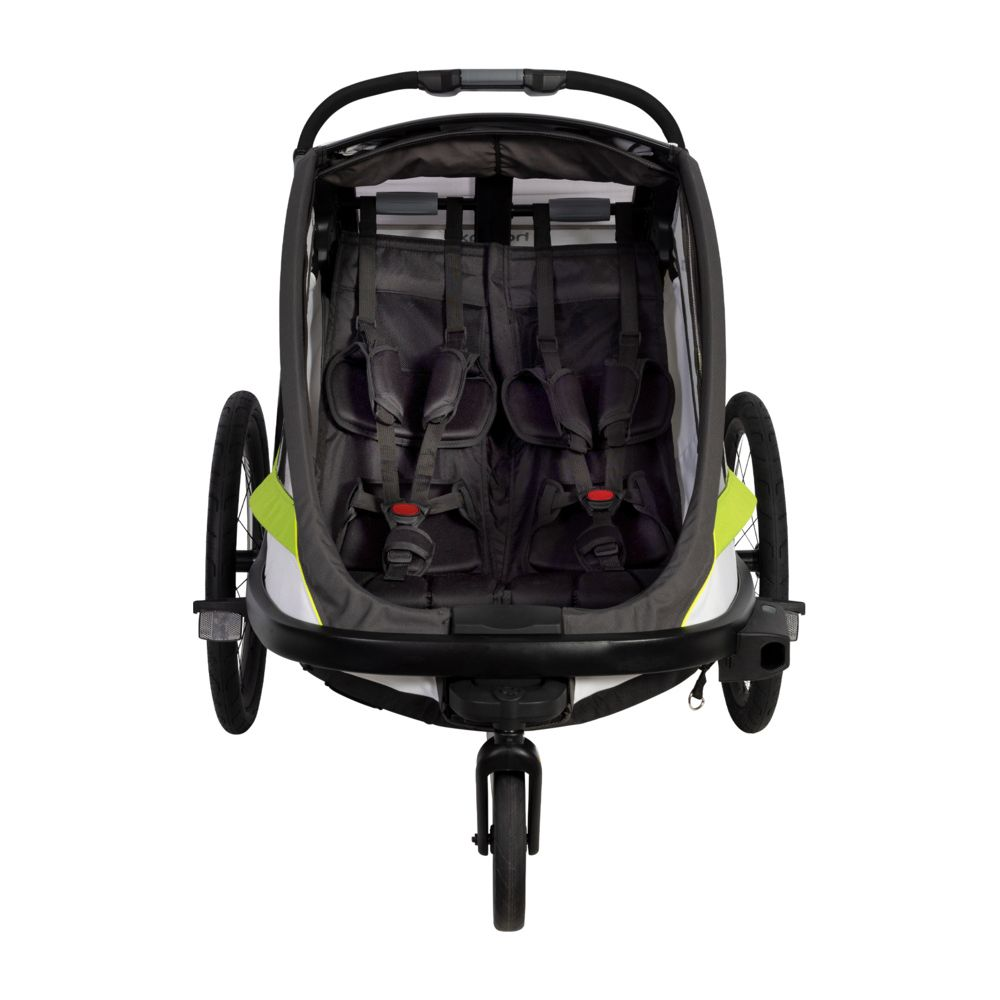 Zweisitziger Kinderanhänger mit Gurten, Rädern und Griff.