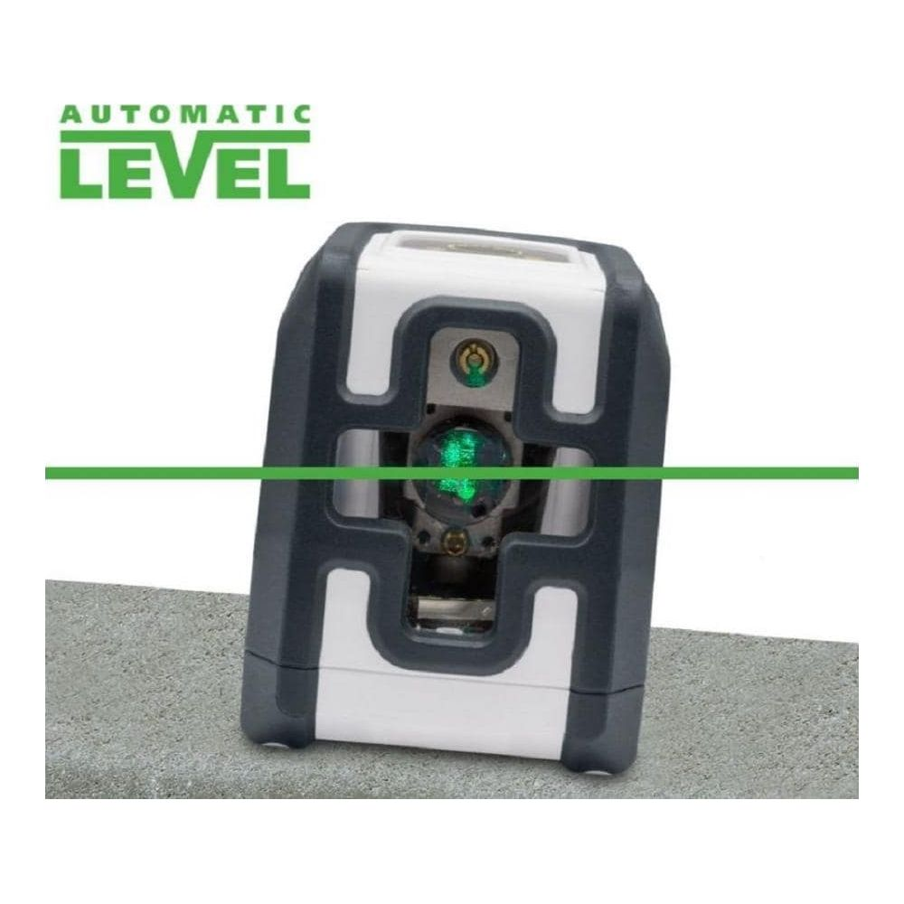 Un niveau automatique avec une ligne laser verte sur une surface en béton.