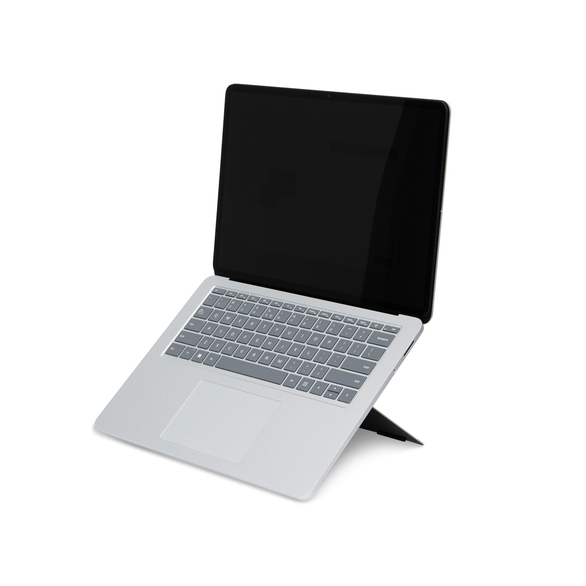 A silver laptop with a black screen stands upright, showing its keyboard and touchpad.