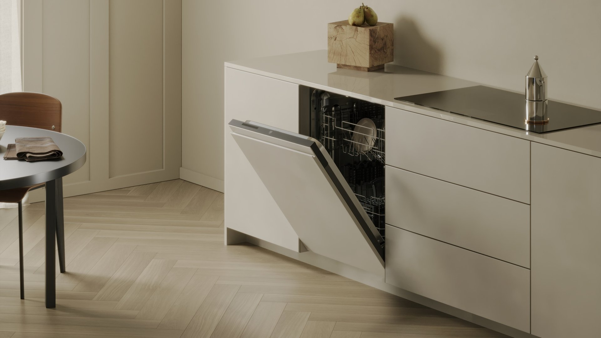 Una cucina moderna con lavastoviglie aperta, piano cottura e tavolo.
