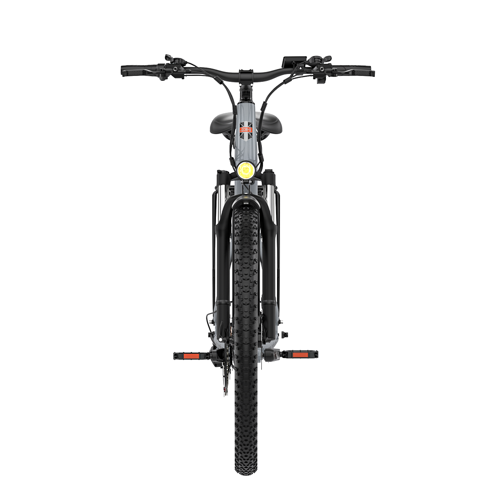 Szary rower elektryczny z przodu z naklejką Union Jack i żółtym światłem.