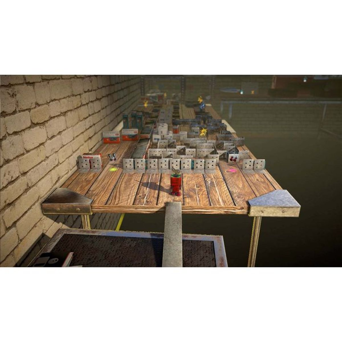 Tavolo in legno con molti blocchi bianchi e grigi, scatole rosse e figure.