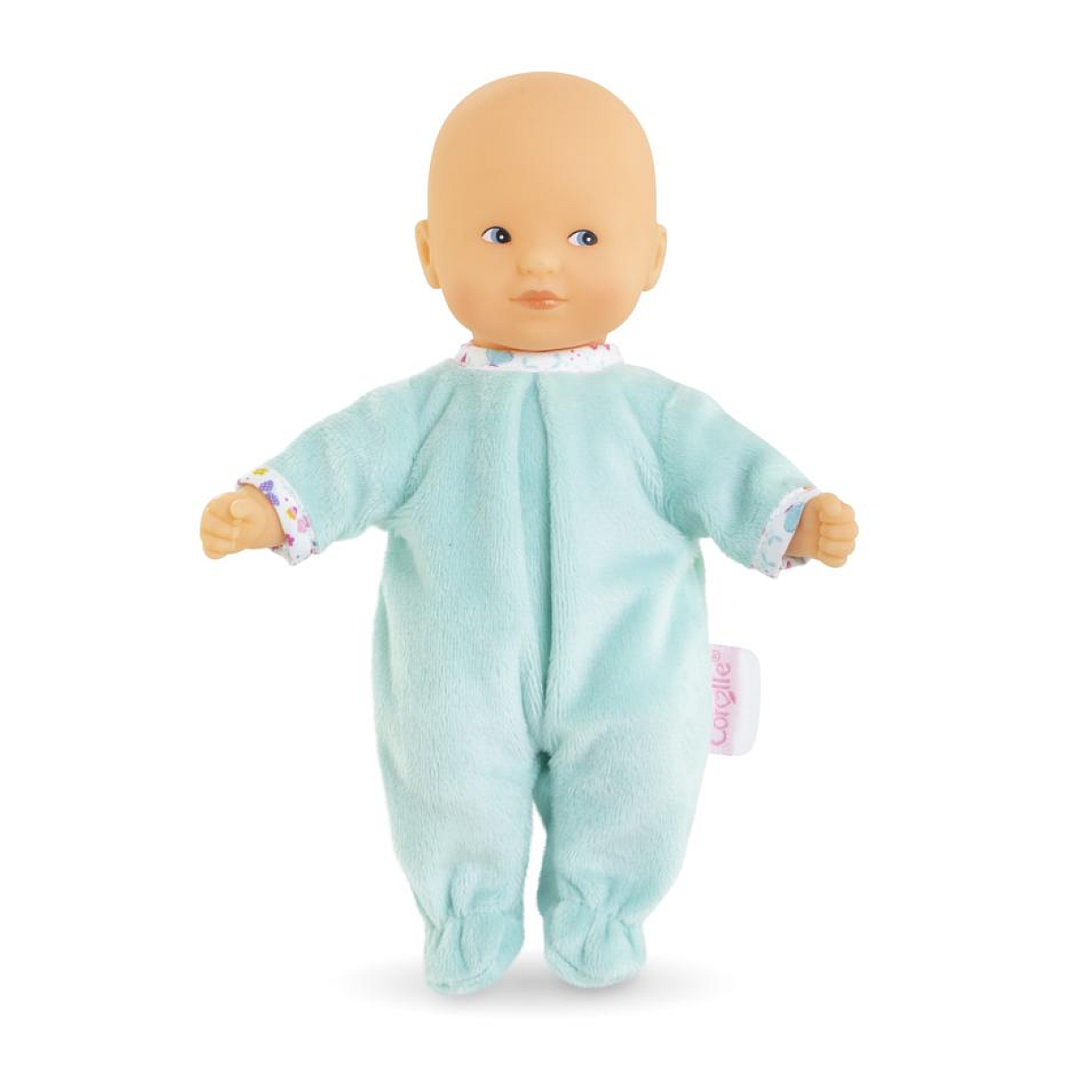 Ein Baby-Puppe in einem hellblauen Strampler mit bunten Manschetten.