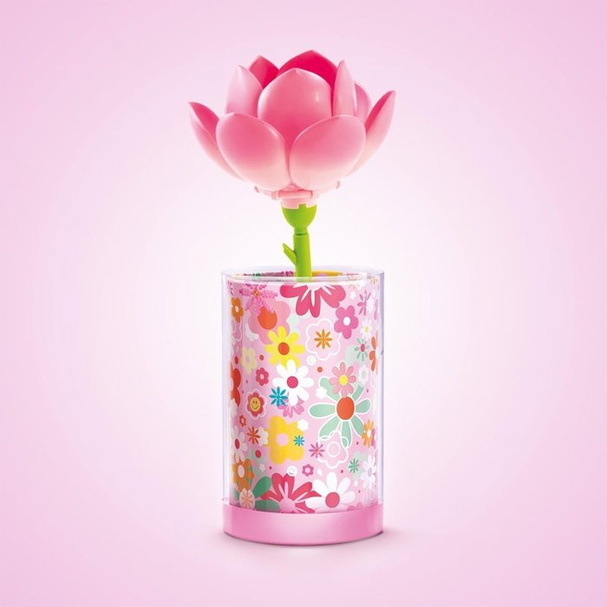 Eine rosa Lotusblume wächst aus einem bunten Blumentopf.