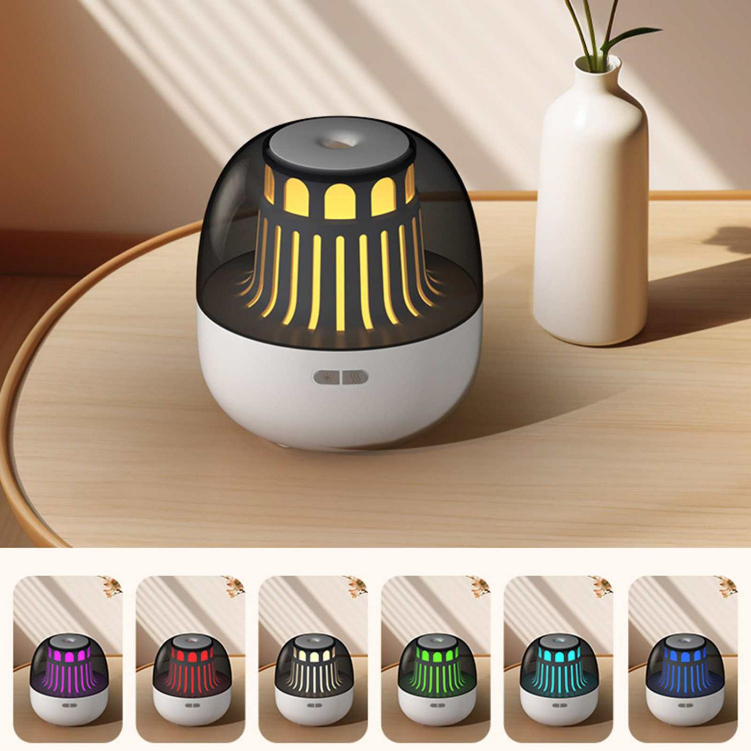 Ein kleiner weißer und schwarzer Diffusor mit gelbem Licht, daneben eine Vase.