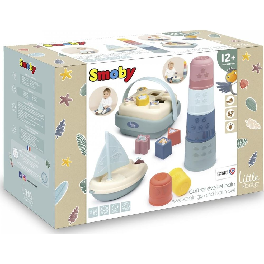 Scatola di un set di giocattoli da bagno Smoby con tazze, barca e forme.