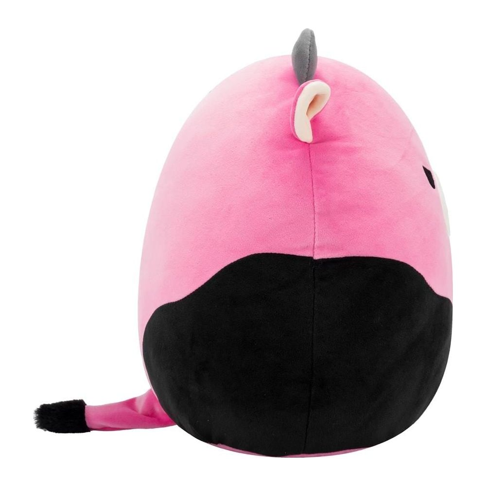 Un peluche rosa con macchie nere e una coda.