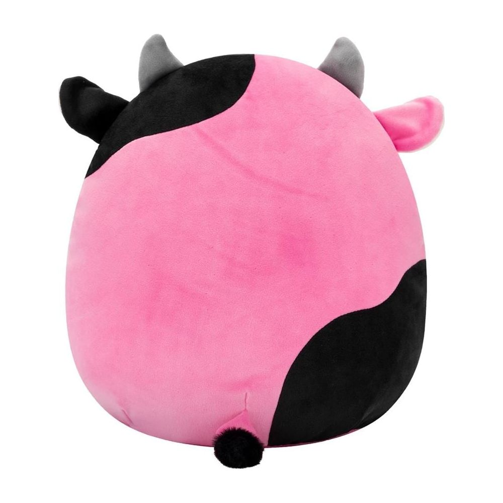 Un giocattolo mucca rosa di peluche con macchie nere e corna grigie.