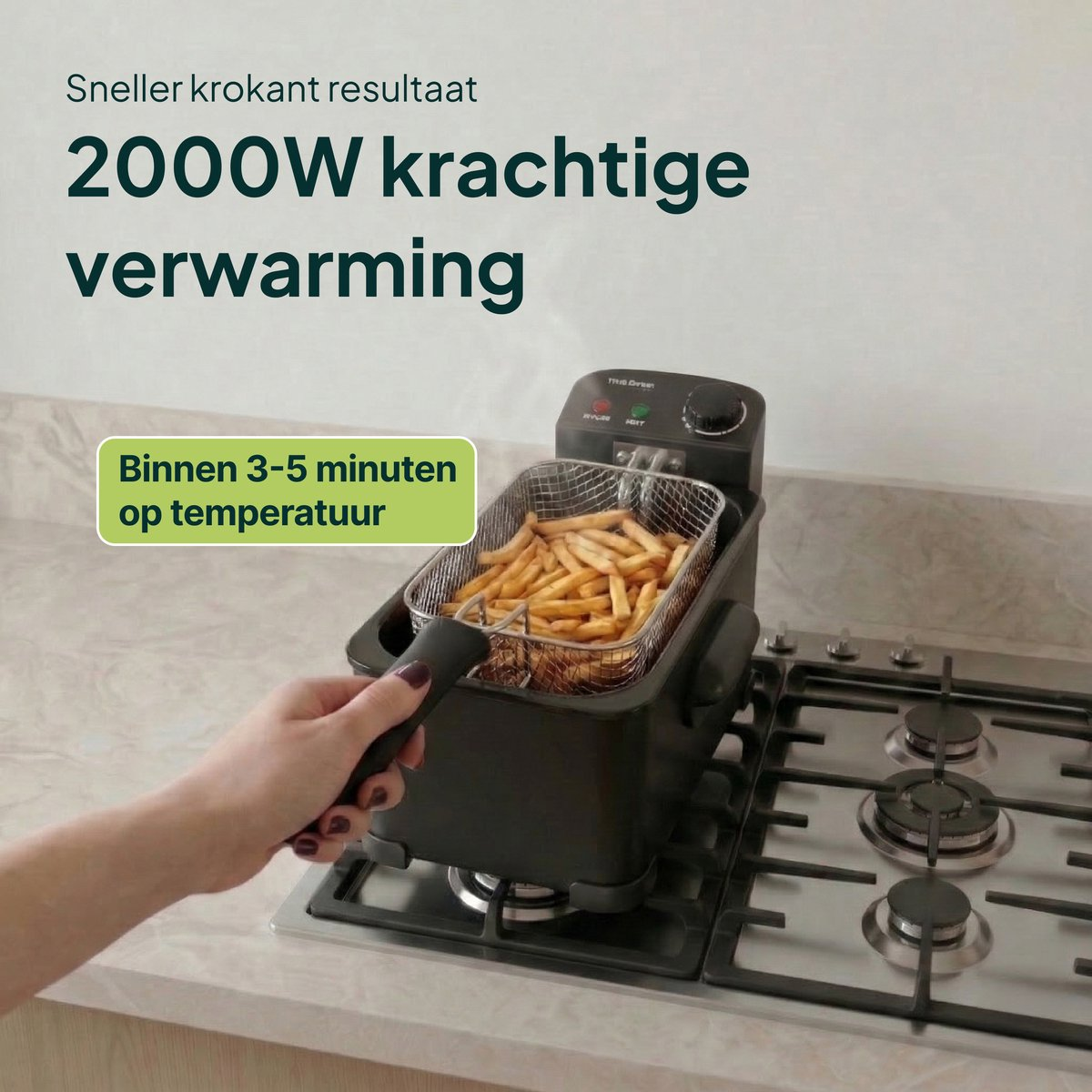 A deep fryer filled with french fries on a gas stove, held by a hand.