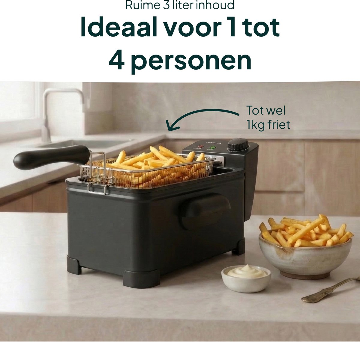A black deep fryer with golden french fries and a small bowl of mayonnaise.