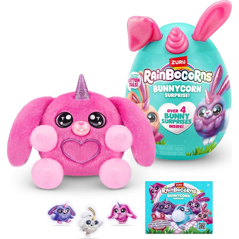 Un giocattolo bunnycorn rosa e soffice con corno e orecchie accanto a una confezione turchese.